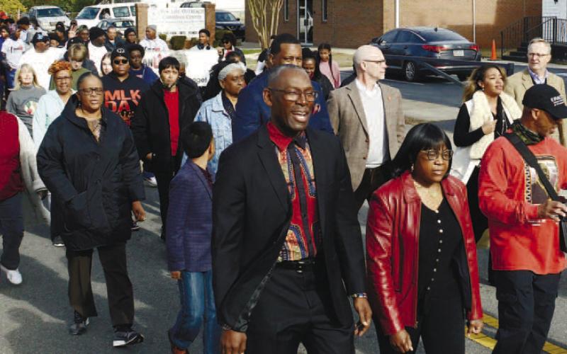 Led by Thedora Sneed (far right), the 2023 Martin Luther King Jr. March departed from the Newlife Outreach Christian Center on Agnes Street in Eatonton.
