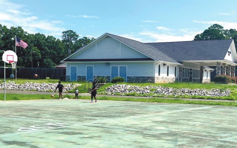 New basketball hoops hang over courts that badly need to be resurfaced next to the park’s event center that is listed for rent on the county’s website. MARK ENGEL/Staff