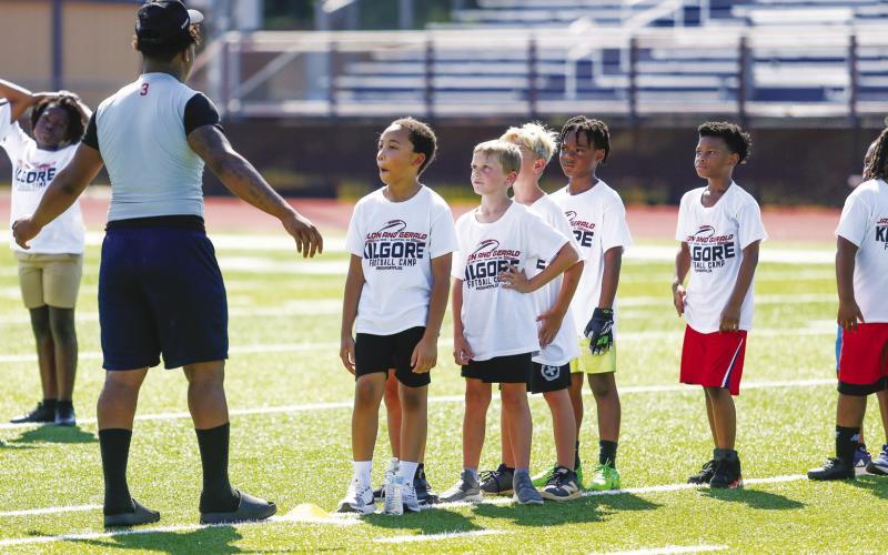 A group of campers gets ready to stretch before the next session of drills.