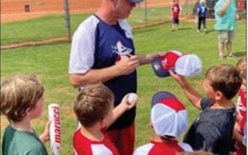 Former Braves pitcher Kevin Millwood signed hats, bats, and balls for several “Fisch campers” last August at the Greene County Recreation Center. Contributed