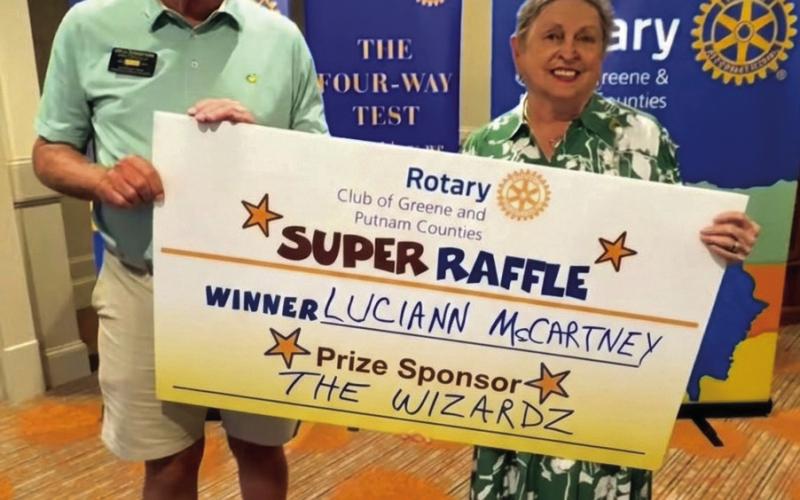 Rotarians Rick Thompson and Micki Tanner presented on behalf of prize sponsor The Wizardz, a residential pressure wash or cleaning valued at $300 to Week 36 prize winner Luciann McCartney, who was not available for the photo. CONTRIBUTED