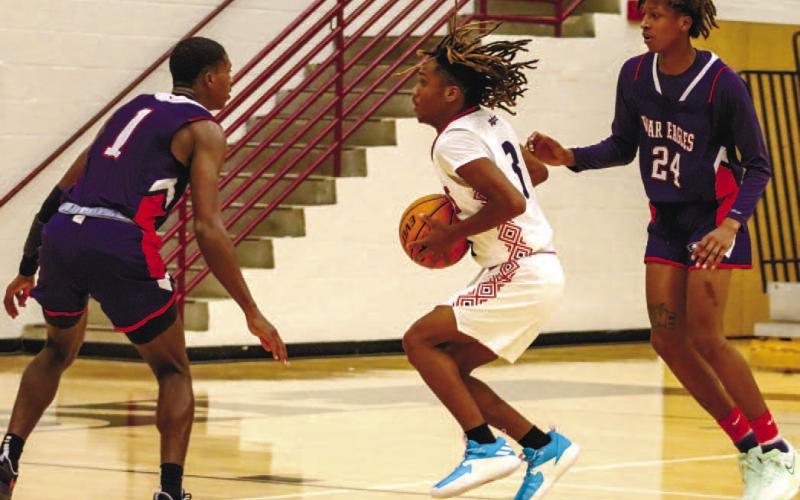 Cameron Stephens (24) and Eren Banks (1) force a Northside player to pass the ball down court. LANCE MCCURLEY/Staff