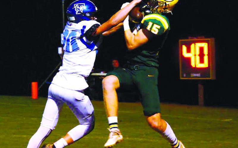 Lawson Wooten (15) goes up to make the catch for Gatewood that extended their lead late in the first half. IAN TOCHER/Staff
