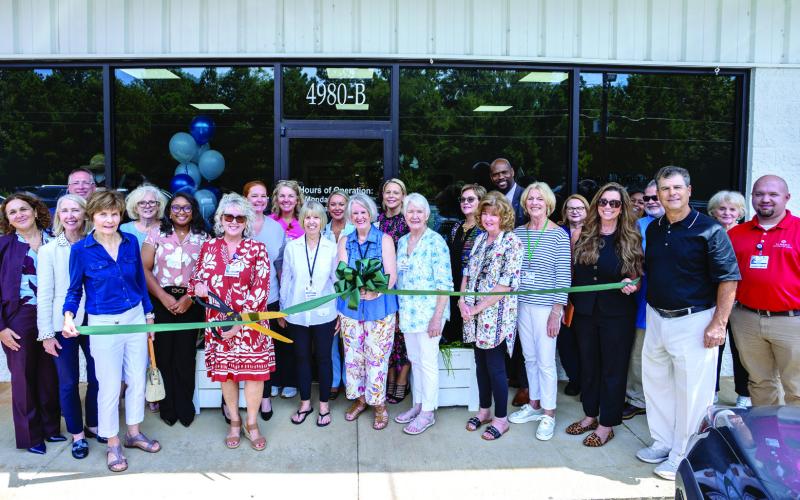 St. Mary's Retail Operations Manager Angie Patterson prepares to cut the ribbon to open St. Mary's Good Samaritan Hospital Upscale Thrift Store in 2025. Photo courtesy of Brock Company Creative CONTRIBUTED