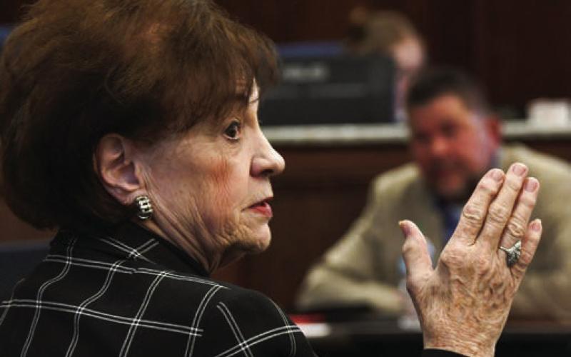 PDA board member Mylle Mangum gestures during her speech as District 1 Commissioner Tom McElhenney listens from his side of the table. IAN TOCHER/Staff