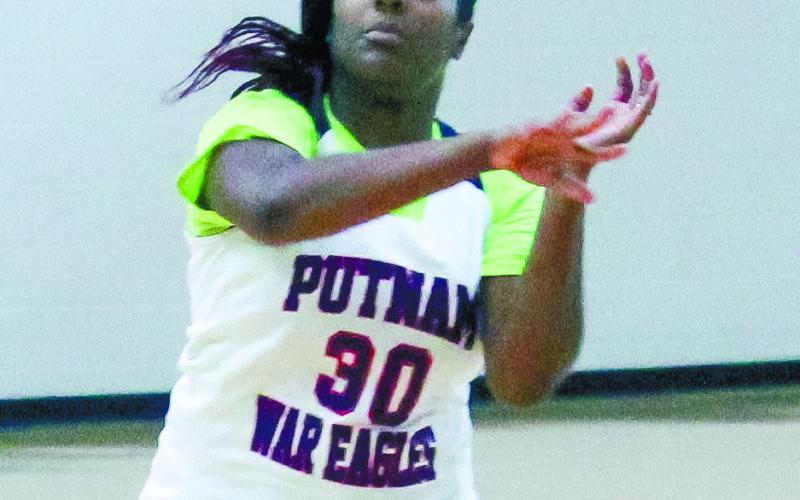 Shakedra Ellison (class of '14) passes the ball to a teammate. TREY NORRIS/Staff