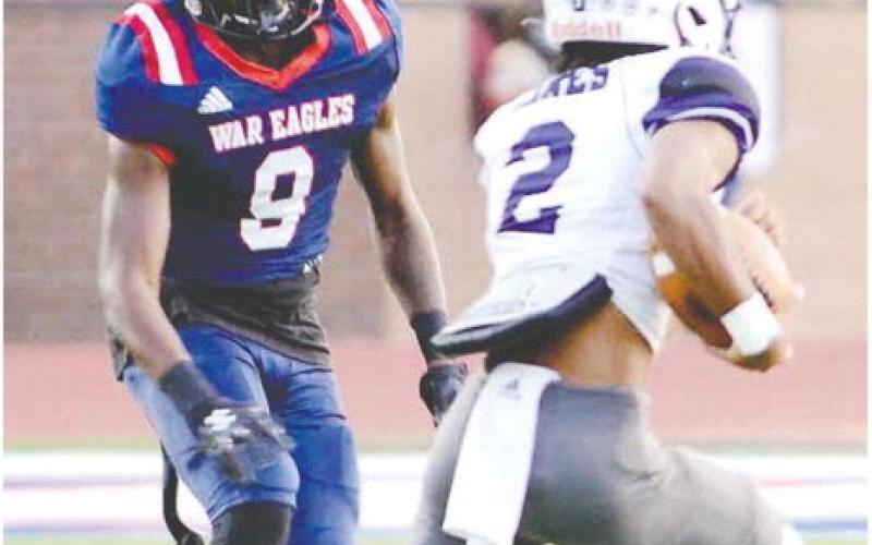 Kaleb Crawford (9) chases a ball carrier in a game earlier this season. IAN TOCHER/Staff
