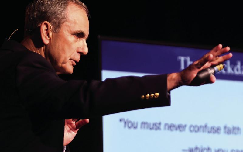 Part history teacher and part motivational life coach, U.S. Air Force Col. (ret.) Lee Ellis kept his audience enthralled with remarkable tales of courage, perseverance, and hope surrounding his more than five years in a Vietnamese POW facility. IAN TOCHER/Staff