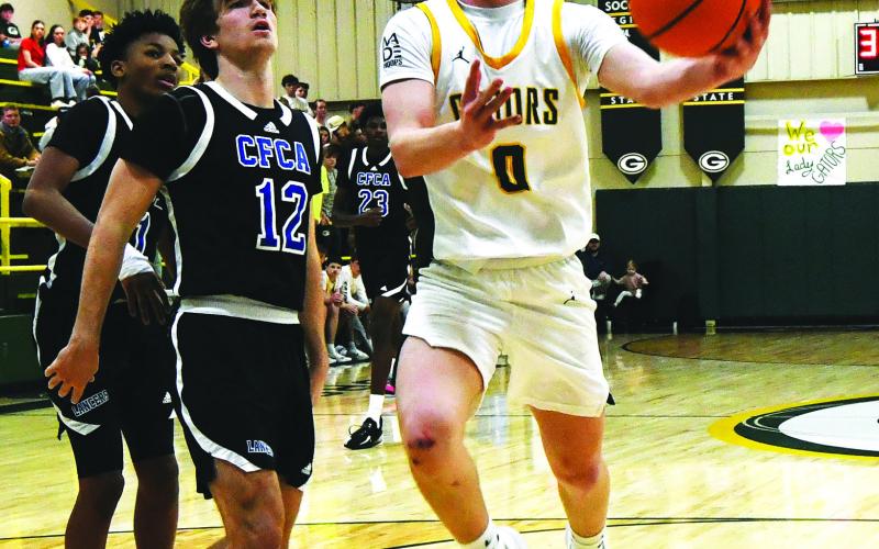 IAN TOCHER/Staff  Then an eighth grader, Bennett Haley attempts a layup through traffic during a game in the 2025-26 season.