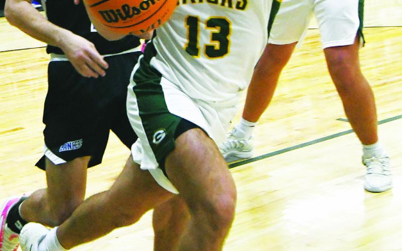 IAN TOCHER/Staff  Landon Moreno drives the baseline past a defender during a game in the 2025-26 season.