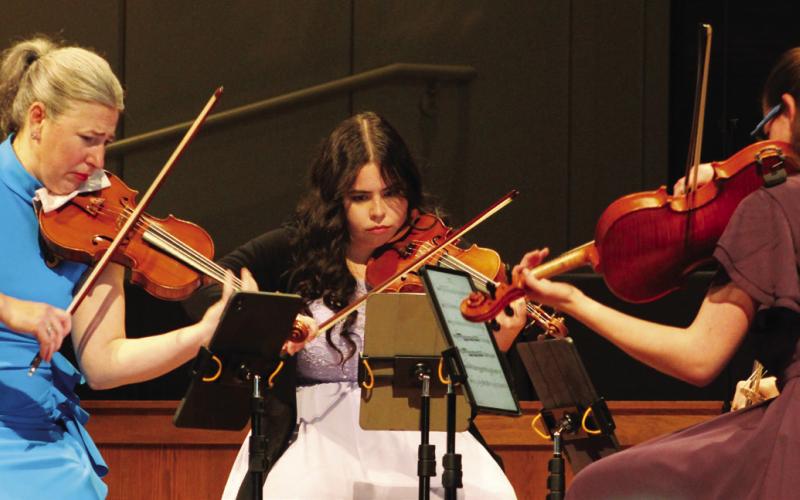 Violinist Amy Schwartz Moretti (left) led the way for Holly Parker (center) and cellist Raman Ramakrishnan during OPAS Unplugged last Sunday.