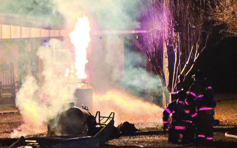 The fire burns off the gas leaking from the propane tank. CONTRIBUTED