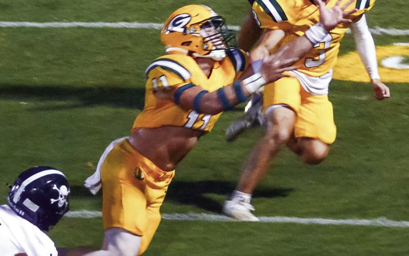Mason Sinclair (11) recovered this fumble by the Southland player (lower left) near the Gators' end zone in the second quarter last Friday night. (IAN TOCHER/Staff)