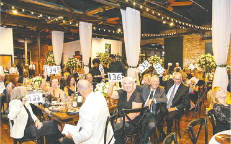 Attendees enjoy the festivities at the Soirée Blanc and Noir fundraiser. CONTRIBUTED