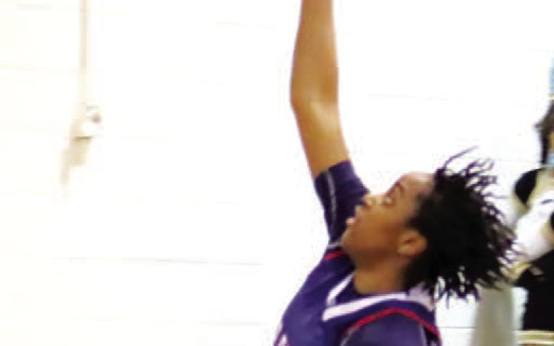 A layup from Kamyra Akins (21) cuts into Greene County’s lead.
