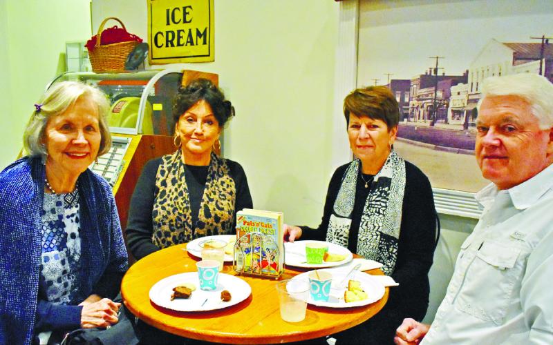 Fred and Rita Koppelmann, Rita Jenkins, and Judy Greer-Mirlle are enjoying snacks and conversation.