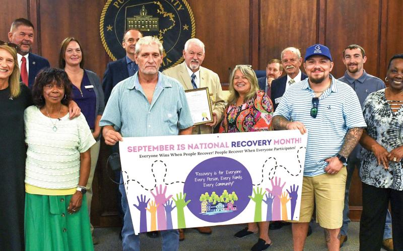 Members of Beyond the Bell, Ocmulgee ATCC, and Georgia Council for Recovery joined the Putnam County Commission last Friday in recognizing September as “National Recovery Month.” IAN TOCHER/Staff
