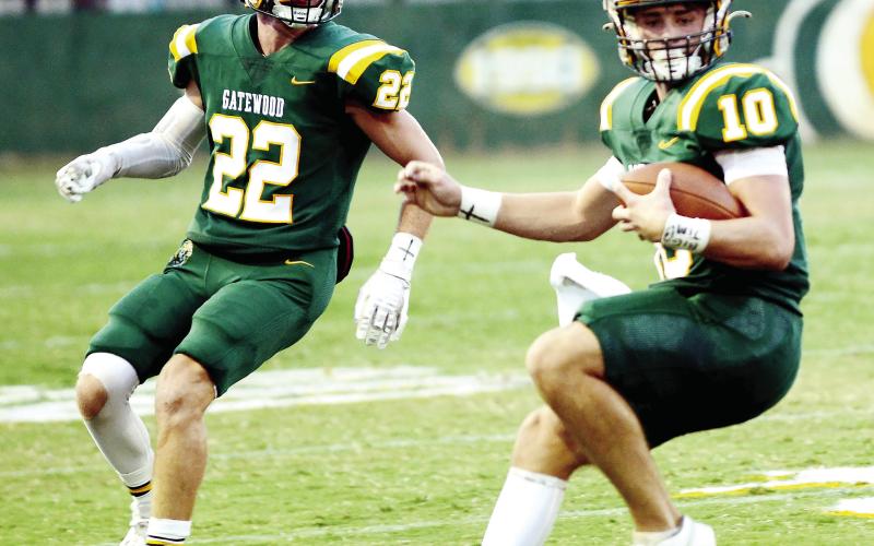 Gatwood's Hunter Johnson (22) and quarterback Ames Johnson (10, no relation) combined for a pair of touchdowns Friday night in a 40-0 rout of the visiting Lions from Loganville  Christian Academy. (IAN TOCHER/Staff)