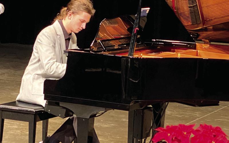 Mark Pinchukov played “Bohemian Rhapsody” during his recital Dec. 12 at Putnam County High School. Scan the QR code to watch his performance. VICTORIA ANADENKO/Staff