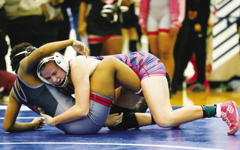 Bryson Pearson gets in position to face an opponent during a match at the traditionals sectionals duals at Locust Grove High School.