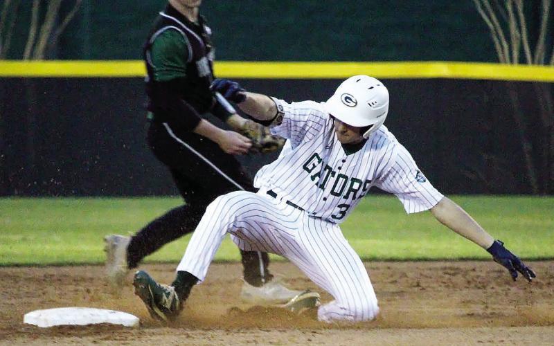 Gatewood’s Walker Roberts slides into second in a game played earlier this season in Eatonton. TREY NORRIS/Staff