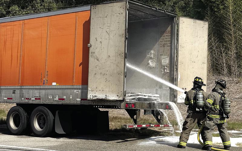 Putnam County firefighters extinguish a fire inside a truck trailer Monday on U.S. Hwy. 441. CONTRIBUTED/ PCFD