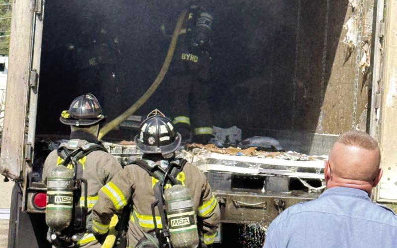 Putnam firefighters ensure the fire is completely extinguished so the trucker could continue to his destination. CONTRIBUTED/PCFD