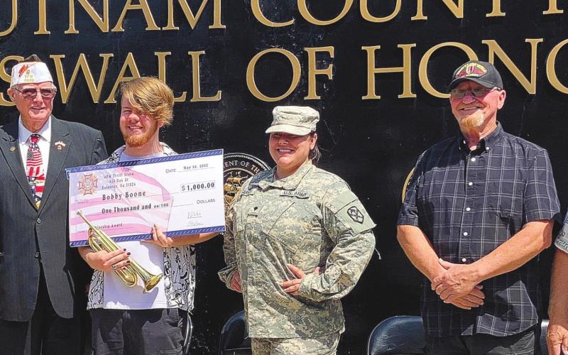 VFW scholarship presentation to Bobby Boone for playing Taps the past four years in each ceremony. LYNN HOBBS/ S t a ff
