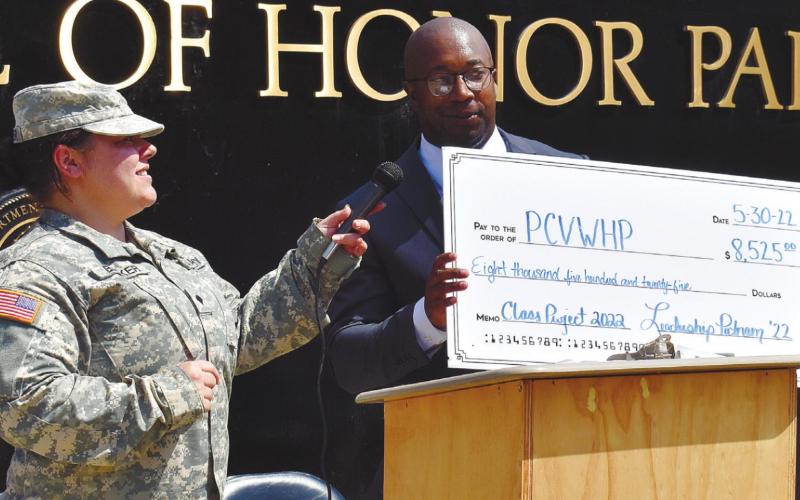 Representing Leadership Putnam, Charles Trumbo presents a check for $8,525 to Nikki Barker for the repairs of the Veterans Wall of Honor. T. MICHAEL STONE/ S t a ff