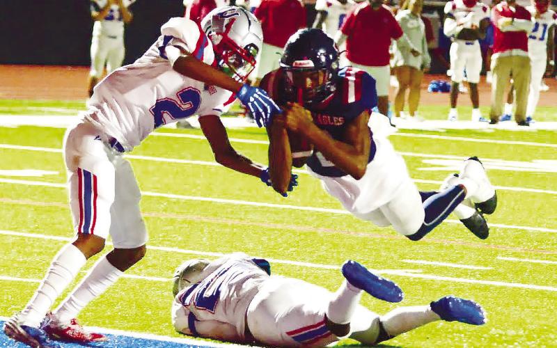 Putnam County quarterback Jamarion Robertson dove across the goal line in the fourth quarter to score a two-point conversion last Friday in a 28-15 win over Westside. IAN TOCHER/Staff