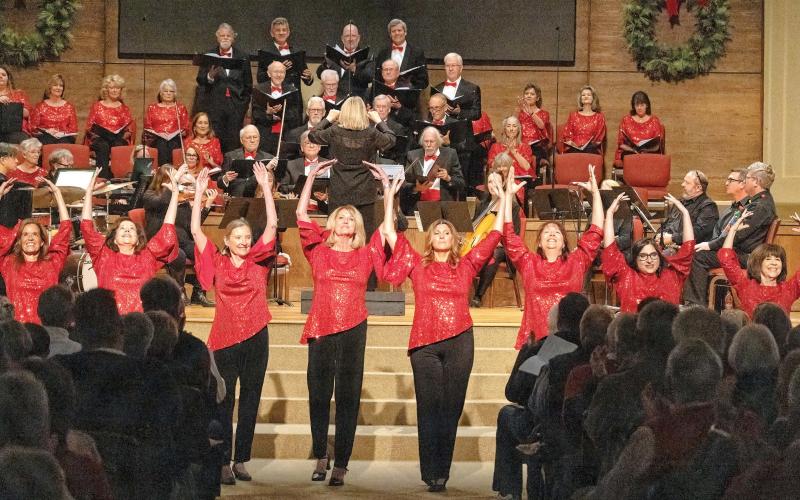 The ladies of the chorus perform a dance choreographed by Maureen Brower and Charlotte Mosteller during “A Tinseltown Christmas.” LEIGH LOFGREN/Staff