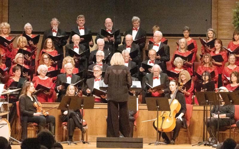 The Lake Country Chorus begins its Christmas program, “A Tinseltown Christmas,” at the First Methodist Church in Greensboro. LEIGH LOFGREN/Staff