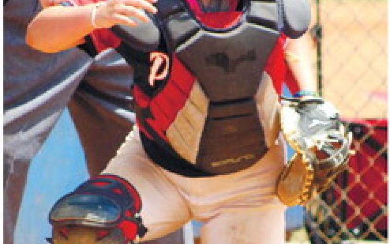 Freshman catcher Addison Hutsell behind the plate. ARELLA CASH/Staff