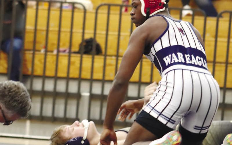 Senior Brayon Farley with crucial pin for the War Eagles, sending the state match to a tiebreaking decision.