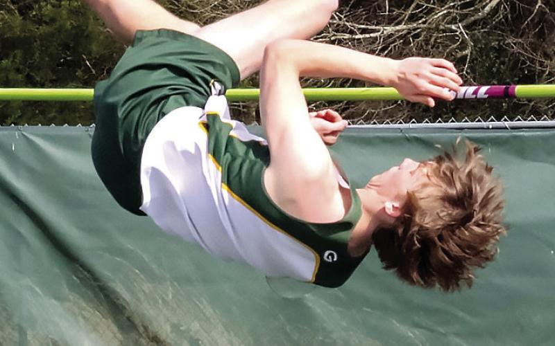 Blake Callaway attempts to jump over the bar during the high jump event at a meet earlier this season. LANCE MCCURLEY/Staff
