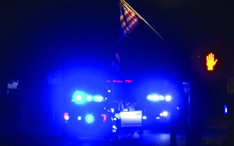 Blue lights illuminated downtown Eatonton Thursday night after a vehicle was observed driving the wrong way. IAN TOCHER/Staff