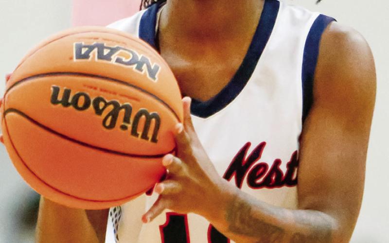 Putnam County senior Journey Waller (10) gets set to attempt a free throw in a win over Morgan County on Nov. 20. LANCE McCURLEY/ Staff