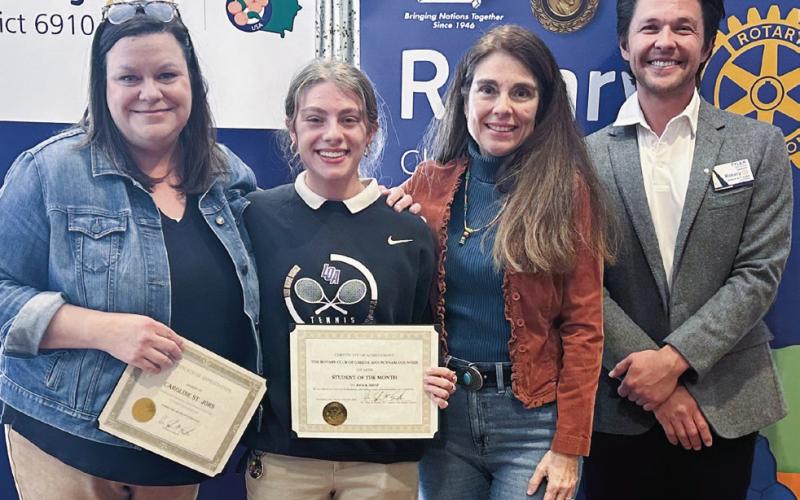 Lake Oconee Academy October student of the month Anika Imhof (center) with Caroline St. John (left), Elvia Imhof, and Rotarian Dr. Tyler Franks. CONTRIBUTED