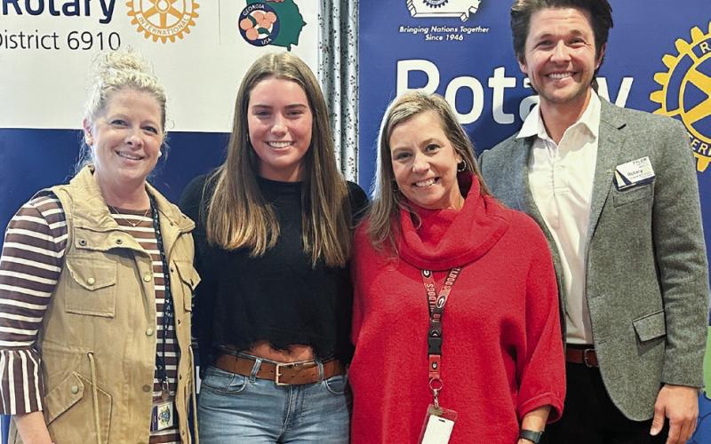 Lake Oconee Academy November student of the month Ella Blythe (center) with Mandy Lipscomb (left), Jennifer Blythe, and Rotarian Dr. Tyler Franks. CONTRIBUTED