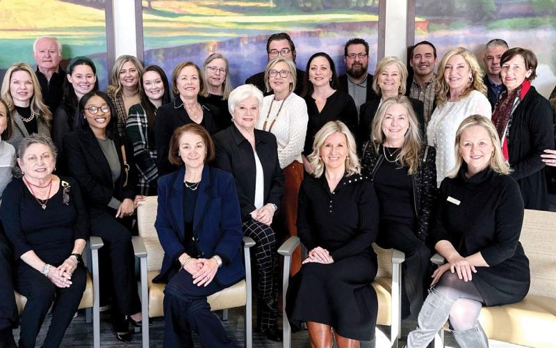 Members of the Heart and Soul Gala Committee, including event chair Riezl Baker (far left), pose with members of the Reynolds Properties team in the operating room waiting area at St. Mary’s Good Samaritan Hospital. CONTRIBUTED