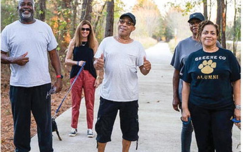 A group of pedestrians enjoys a walk on the Firefly Trail. CONTRIBUTED