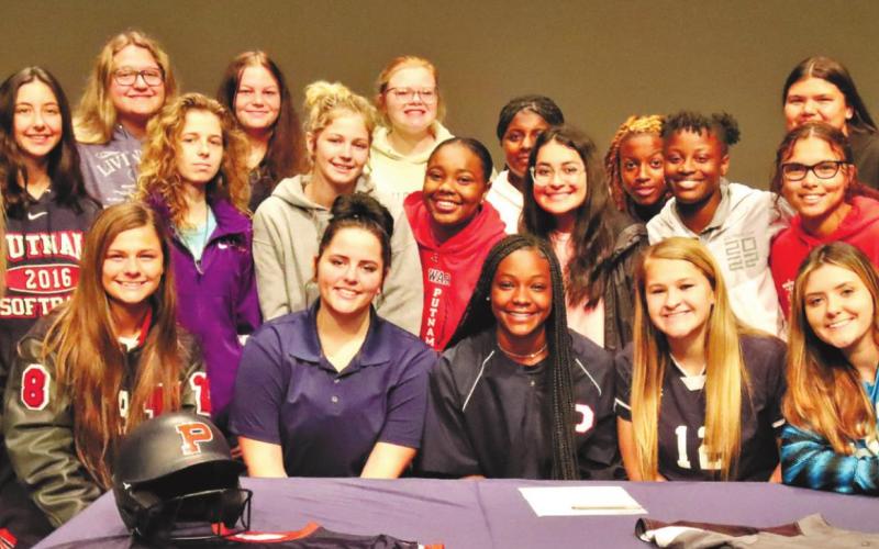 Robertson and her teammates, friends and family pose for a photo during her signing. ARELLA CASH/Staff