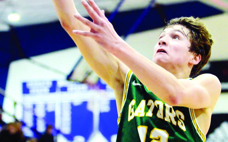 Gatewood’s Matt Allen goes up for two points in the Gator’s 84-52 win at Piedmont Academy in Monticello last Friday. Allen finished the night with 47 points to his credit. IAN TOCHER/Staff