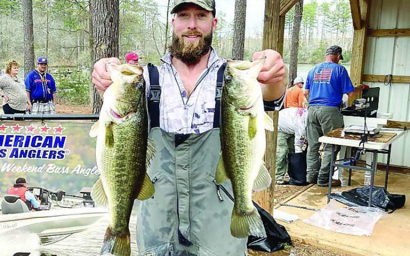 Sam Montgomery of Milledgeville shows off some of his catch that earned him a win early this month in the American Fishing Tour Div. 72 tournament on Lake Sinclair. CONTRIBUTED