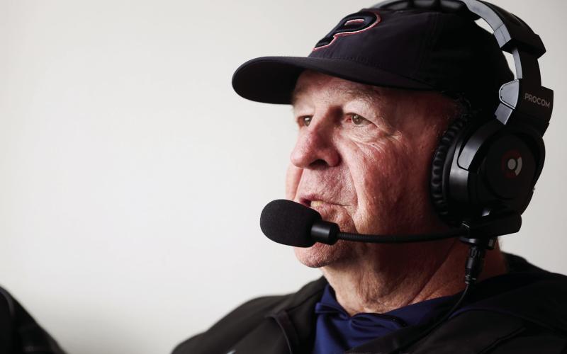 Winslette sits in the visiting coaches box at Morgan County High School in Madison. “When I do finally quit, I’m going to still want to be there (at a high school football game) on a Friday night,” he says. Abbey Cutrer/AJC