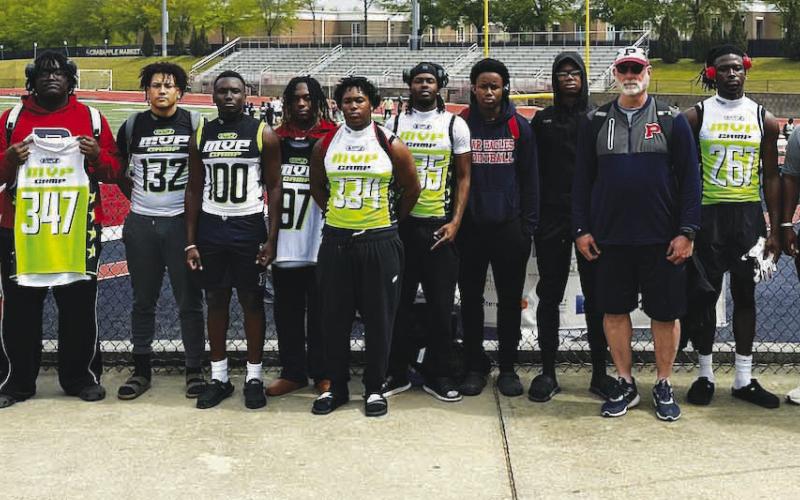 Putnam County football players and coaches pose for a photo following the MVP Camp on Sunday at Milton High School in the northern suburbs of Atlanta. CONTRIBUTED