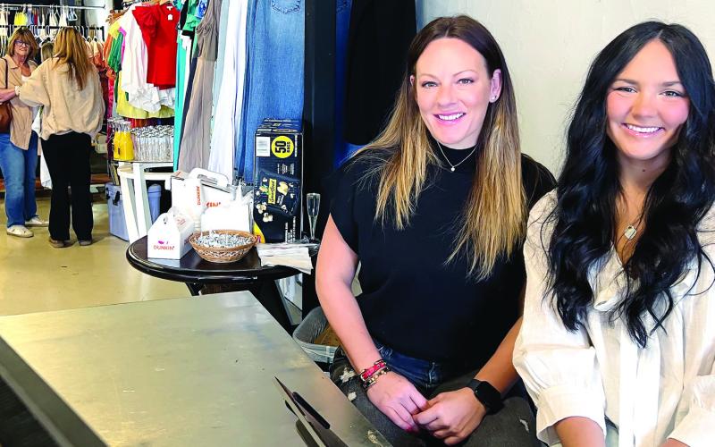 Hairstylist Lexi Camp (left) operates a small salon at the rear of Goldie &amp;amp; Co., a new womenswear boutique established on South Jefferson Avenue in downtown Eatonton by her young entrepreneur friend Colby Fournier. IAN TOCHER/Staff