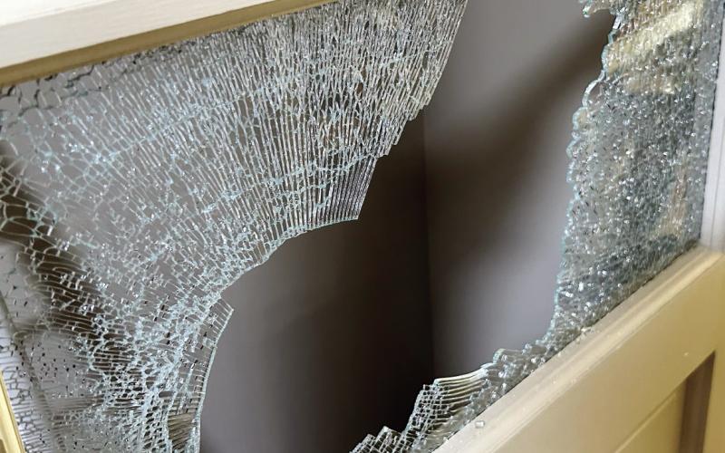 A broken window in the door was used to gain entry. (CONTRIBUTED BY PCSO)