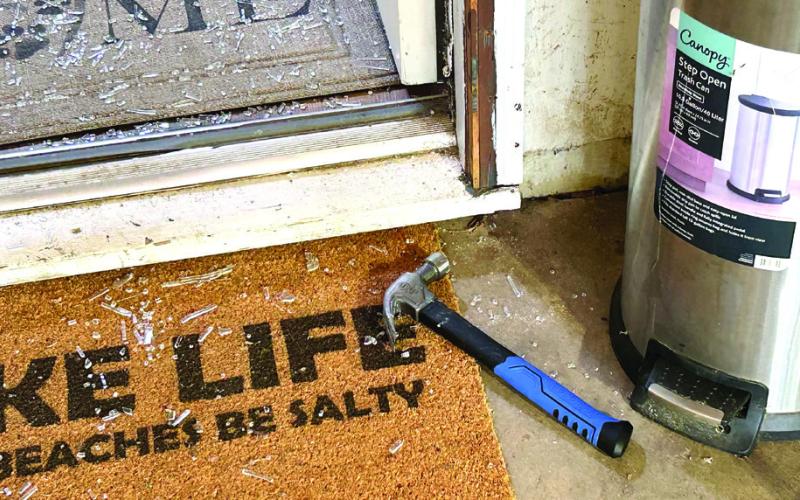 The hammer used to break the glass in the door window is on the doormat. (CONTRIBUTED BY PCSO)
