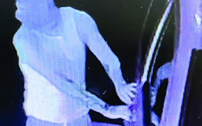 Although wearing a mask, the burglar was identified by his tattoo and distinctive shoes visible on the security camera. (CONTRIBUTED BY PCSO)